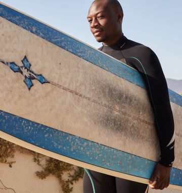 Athlete with high testosterone is doing surfing